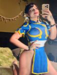 1girl black_hair blue_dress breasts cellphone chun-li cosplay dress hair_ornament large_breasts nipples nipples_visible_through_clothing selfie solo street_fighter thighs