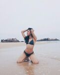 1girl asian asian_female beach bikini bikini_bottom bikini_top black_hair female female_focus female_only flat_chest instagram malaysian model navel nik_raisa aizen petite posing ribs skinny sole_female solo tan_skin