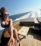 1girl big_breasts bikini boat female german large_breasts ocean orange_hair outside palina_rojinski red_hair redhead sunglasses tits water