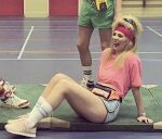 1girl 2019 80s_hairstyle blonde_hair dutch female female_only gym gym_clothes gym_uniform headband instagram laughing marit_brugman on_ground pink_shirt red_headband sfw shoes short_shorts short_sport_shorts shorts sitting_on_ground socks solo solo_female sports_shorts watch