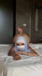 1girl ass ass_up bed bedroom face_down ass up feet feet_up female female_focus female_only female_solo hijab looking_at viewer lying soles solo solo_female solo_focus topless_female