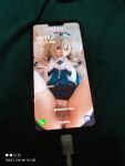 1boy asian ass barbara_(genshin_impact) blonde_hair chinese cosplay femboy funny genshin_impact legs_up lipstick long_hair looking_at_viewer penis phone solo testicles text transgender trap wuuuuuucy