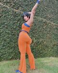 1girl arm_raised armpits ass clothed clothed_female cosplay dat_ass dragon_ball female female_focus female_only genderswap huge_ass huge_breasts looking_back medium_hair non-nude outside solo solo_female solo_focus son_goku tight_fit
