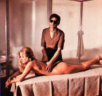 1970s alternate_angle ass barbara_bouchet bare_shoulders barefoot blonde_hair brown_hair colored_photo crossed_legs femsub heavenly_ass large_breasts large_tits long_hair lowres maledom maria_zani massage massage_table short_hair sideboob sunglasses the_black belly of the tarantula touching_back unbothered