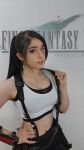 1girl black_hair cosplay earrings long_hair solo tifa_lockhart tifa_lockhart_(cosplay)