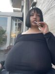 1girl black_dress black_hair cigarette huge_breasts italian massive_breasts mouth_open non-nude outside smoking solo solo_female vvalentinabonetalli