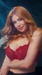 1girl big_breasts bra breasts celebrity cleavage female german large_breasts lingerie massive_breasts orange_hair palina_rojinski posing red_bra red_hair redhead teasing tits video webm