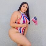 1girl american_flag bbw big_ass big_breasts big_butt bodysuit breasts bubble_butt clothed curvy dark_hair eyelashes female female_only latina legs long_hair looking_at_viewer milf model nancy_hernandez non-nude outdoors parted_lips patriotic solo standing thick thick_thighs tight_fit wide_hips