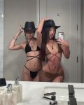 2girls asian_female asscheeks cowboy_hat flat_chest mask micro_bikini microbikini mirror_selfie rave skimpy_clothing tanlines